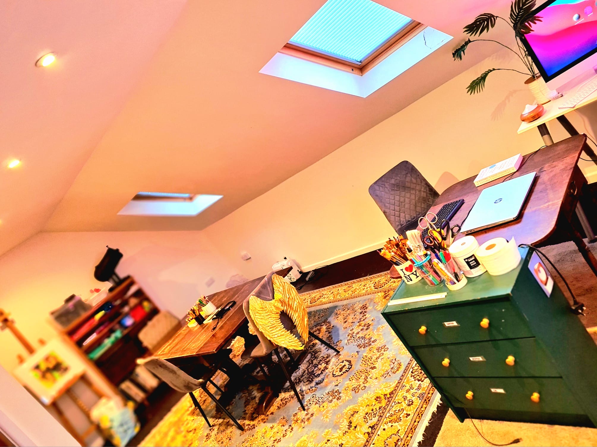 Colourful artwork displayed inside the Hurrah Art Club studio